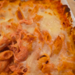 Organic Pasta Bake with marinara and melted mozzarella cheese in a casserole dish