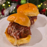 Open faced organic meatball subs on toasted brioche rolls with melted mozzarella