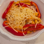 Creamy pink sauce penne pasta in a bowl with parmesan cheese