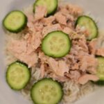 Mediterranean salmon rice bowl with cucumber and lemon